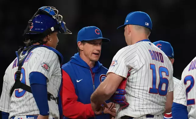 Chicago Cubs manager Craig Counsell (11) removes starting pitcher Michael Boyd (16) as he makes a pitching change during the fifth inning of a baseball game against the Philadelphia Phillies, Wednesday, April 22, 2026, in Chicago. (AP Photo/Erin Hooley)