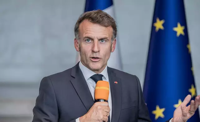 France's President Emmanuel Macron speaks during a joint press conference with African Union Commission Chairperson Mahmoud Ali Youssouf, not pictured, at the African Union headquarters in Addis Ababa, Ethiopia, Wednesday, May 13, 2026. (AP Photo/Amanuel Sileshi)