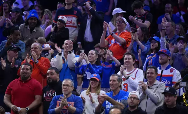 New York Knicks' fans cheer during the first half of Game 4 against the Philadelphia 76ers in a second-round NBA basketball playoffs series Sunday, May 10, 2026, in Philadelphia. (AP Photo/Matt Slocum)