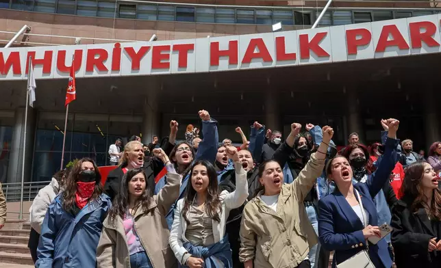 Supporters of Turkey's main opposition Republican People's Party (CHP) shout slogans as they gather at party's headquarters in Ankara, Sunday, May 24, 2026. (Ugur Yildirim/DIA Photo via AP)