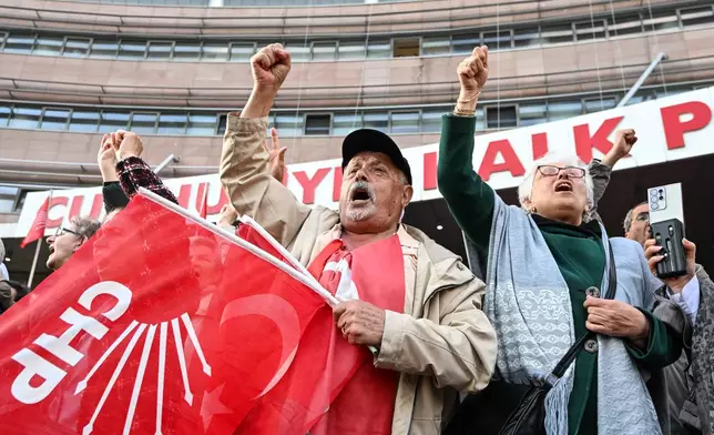 Supporters of Turkey's main opposition Republican People's Party, or CHP, shout slogans as they gather outside the party's headquarters in Ankara, Friday, May 22, 2026. (Gunsu Ozmen/DIA Photo via AP)