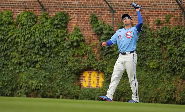 Chicago Cubs' Seiya Suzuki makes a catch during the ninth inning of a baseball game against the Houston Astros on Friday, May 22, 2026, in Chicago. (AP Photo/Melissa Tamez)