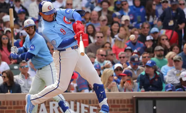 Chicago Cubs' Miguel Amaya singles during the sixth inning of a baseball game against the Houston Astros on Friday, May 22, 2026, in Chicago. (AP Photo/Melissa Tamez)