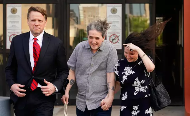 Former death row prisoner Richard Glossip, center, exits a detention facility alongside his wife Lea Glossip, right after being granted bond while awaiting retrial Thursday, May 14, 2026, in Oklahoma City. (AP Photo/Nick Oxford)