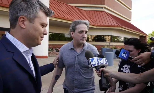 Former death row prisoner Richard Glossip, center, speaks to media after exiting a detention facility after being granted bond while awaiting retrial Thursday, May 14, 2026, in Oklahoma City. (AP Photo/Nick Oxford)