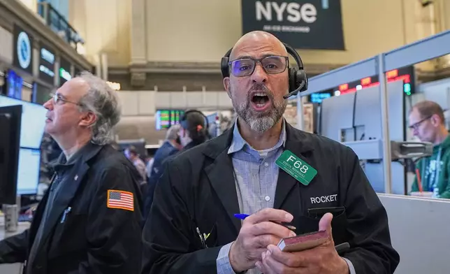 Options trader Steven Rodriguez, center, works on the floor of the New York Stock Exchange, Monday, May 11, 2026. (AP Photo/Richard Drew)