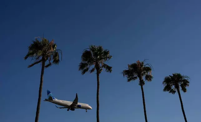 A United Airlines passenger jet approaches Los Angeles International Airport in Los Angeles, Wednesday, May 20, 2026. (AP Photo/Jae C. Hong)