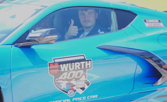 Honorary pace car driver Dallas Mavericks forward Cooper Flagg prepares for a NASCAR Cup Series auto race at Texas Motor Speedway in Fort Worth, Texas, Sunday, May 3, 2026. (AP Photo/LM Otero)