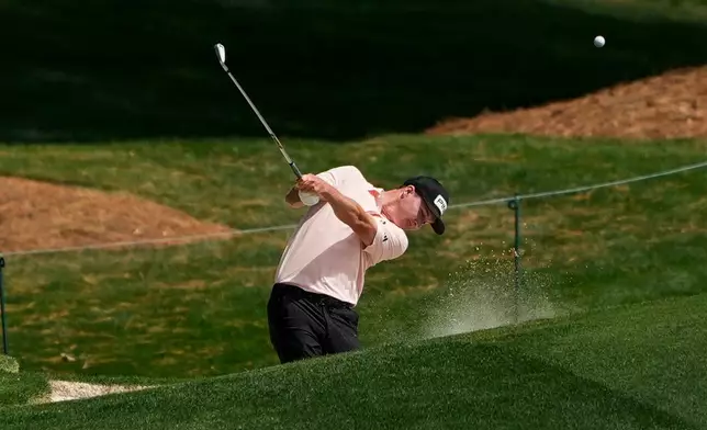 Matt McCarty hits from the 18th fairway during first round of the Truist Championship golf tournament at the Quail Hollow Club, Thursday, May 7, 2026, in Charlotte, N.C. (AP Photo/Chris Carlson)