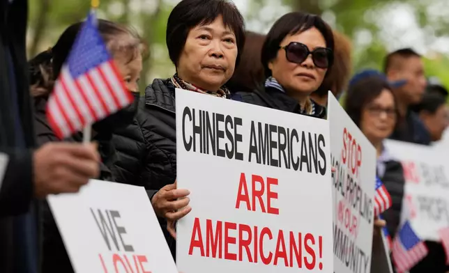 Supporters of Lu Jianwang, also known as Harry Lu, stand outside a federal courthouse before the opening of his trial in New York, Wednesday, May 6, 2026. (AP Photo/Seth Wenig)