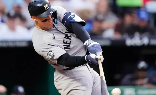 New York Yankees' Aaron Judge hits an RBI double during the fifth inning of baseball game against the Kansas City Royals, Tuesday, May 26, 2026, in Kansas City, Mo. (AP Photo/Charlie Riedel)