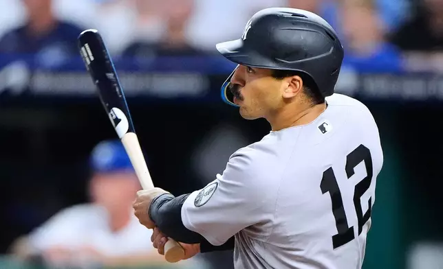 New York Yankees' Trent Grisham watches his solo home run during the seventh inning of baseball game against the Kansas City Royals, Tuesday, May 26, 2026, in Kansas City, Mo. (AP Photo/Charlie Riedel)