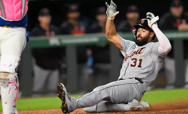Detroit Tigers' Riley Greene scores on a single hit by teammate Wenceel Perez during the seventh inning of a baseball game against the Kansas City Royals in Kansas City, Mo., Sunday, May 10, 2026. (AP Photo/Reed Hoffmann)