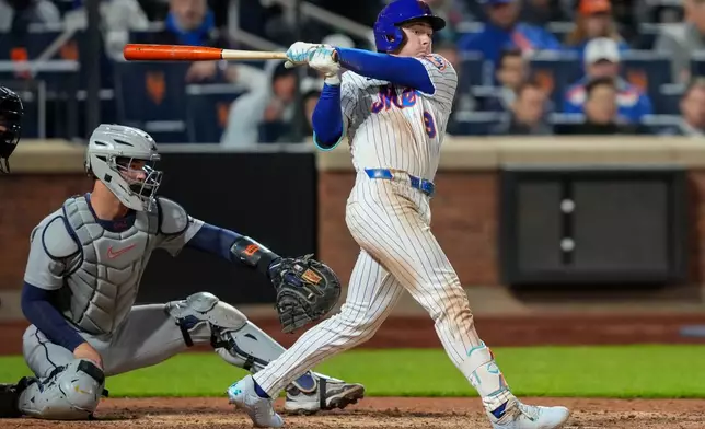New York Mets' A.J. Ewing (9) hits an RBI triple during the seventh inning of a baseball game against the Detroit Tigers, Tuesday, May 12, 2026, in New York. (AP Photo/Yuki Iwamura)