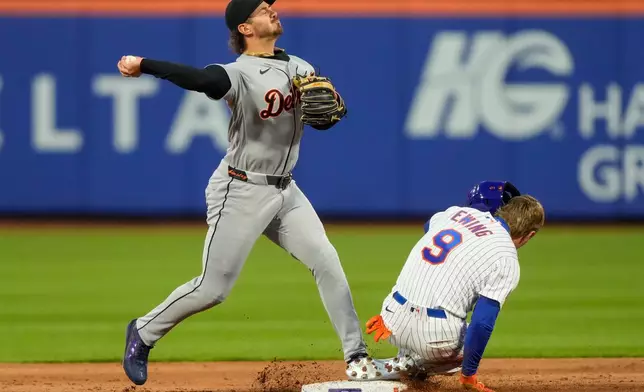 Detroit Tigers pitcher Jack Flaherty (9) throws to first base after forcing New York Mets' A.J. Ewing (9) out at second base during the second inning of a baseball game , Tuesday, May 12, 2026, in New York. (AP Photo/Yuki Iwamura)