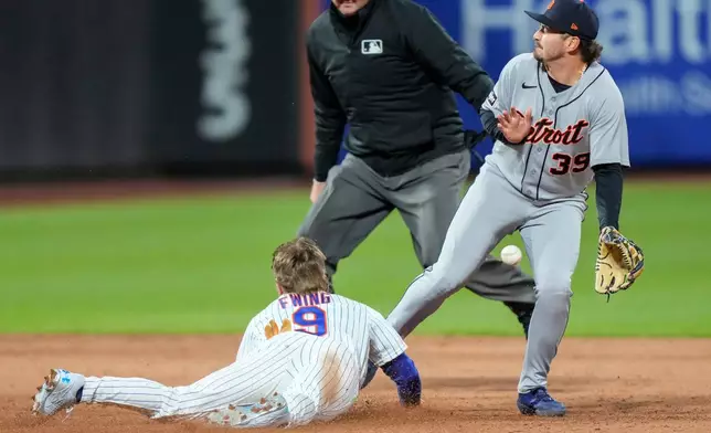 New York Mets' A.J. Ewing (9) successfully steals second base during the sixth inning of a baseball game against the Detroit Tigers, Tuesday, May 12, 2026, in New York. (AP Photo/Yuki Iwamura)