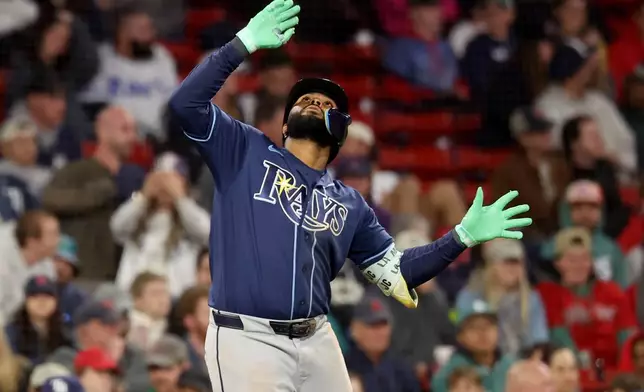 Tampa Bay Rays' Junior Caminero gestures after hitting two run home run during the ninth inning of a baseball game against the Boston Red Sox, Thursday, May 7, 2026, in Boston. (AP Photo/Mark Stockwell)