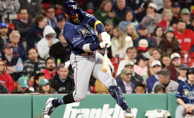 Tampa Bay Rays designated hitter Yandy Díaz hits a ground rule double during the ninth inning of a baseball game against the Boston Red Sox, Thursday, May 7, 2026, in Boston. (AP Photo/Mark Stockwell)