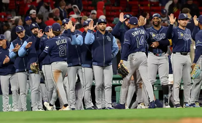 The Tampa Bay Rays celebrate their win over the Boston Red Sox in a baseball game, Thursday, May 7, 2026, in Boston. (AP Photo/Mark Stockwell)