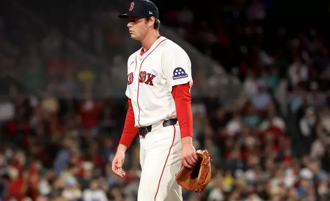 Boston Red Sox pitcher Jake Bennett walks off the field after being pulled out of the game during the sixth inning of a baseball game against the Tampa Bay Rays, Thursday, May 7, 2026, in Boston. (AP Photo/Mark Stockwell)