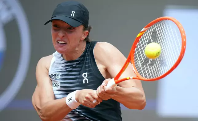 Poland's Iga Swiatek returns the ball to United State's Caty McNally during their match at the Italian Open tennis tournament, in Rome, Friday, May 8, 2026. (AP Photo/Andrew Medichini)