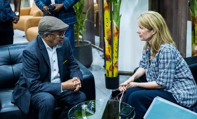 Director General of the World Health Organisation (WHO), Tedros Adhanom Ghebreyesus, left, is welcomed by UK Foreign Secretary Yvette Cooper at N'djili International Airport in Kinshasa, Congo, Thursday, May 28, 2026. (AP Photo/Samy Ntumba Shambuyi)