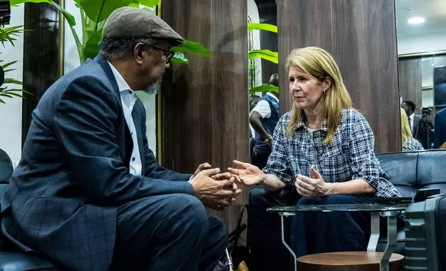 Director General of the World Health Organisation (WHO), Tedros Adhanom Ghebreyesus, left, is welcomed by UK Foreign Secretary Yvette Cooper at N'djili International Airport in Kinshasa, Congo, Thursday, May 28, 2026. (AP Photo/Samy Ntumba Shambuyi)