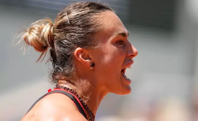 Aryna Sabalenka of Belarus reacts as she plays against Jessica Bouzas Maneiro of Spain during their first round women's singles tennis match at the French Open tennis tournament in Paris, Tuesday, May 26, 2026. (AP Photo/Christophe Ena)