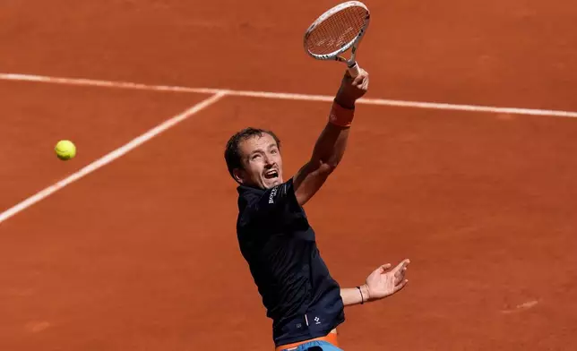 Daniil Medvedev of Russia returns to Adam Walton of Australia during their first round men's singles tennis match at the French Open tennis tournament in Paris, Tuesday, May 26, 2026. (AP Photo/Christophe Ena)