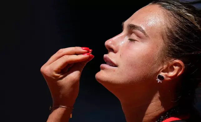 Aryna Sabalenka of Belarus reacts as she plays against Jessica Bouzas Maneiro of Spain during their first round women's singles tennis match at the French Open tennis tournament in Paris, Tuesday, May 26, 2026. (AP Photo/Christophe Ena)