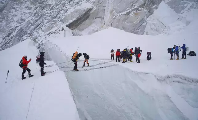 Mountaineers participate in a training session at the Khumbu Icefall as they prepare for their ascent to the summit of Mount Everest, Nepal, Saturday, May 9, 2026. (AP Photo/Pasang Rinzee Sherpa)