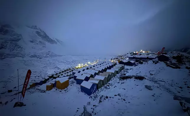 Snow covers tents during a period of inclement weather at the Everest Base Camp, Nepal, Saturday, May 9, 2026. (AP Photo/Pasang Rinzee Sherpa)