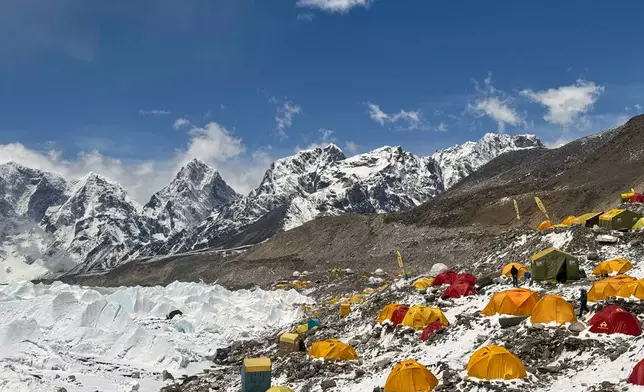 Mountaineers' and guides' tents are spread over at the base camp of Mount Everest, Nepal, Sunday, May 10, 2026. (AP Photo/Pasang Rinzee Sherpa)