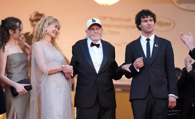 Jaya Harper, from left, Laura Dern, Bruce Dern, and Ellery Harper pose for photographers upon arrival at the premiere of the film 'De Gaulle: Tilting Iron' at the 79th international film festival, Cannes, southern France, Wednesday, May 20, 2026. (AP Photo/John Locher)