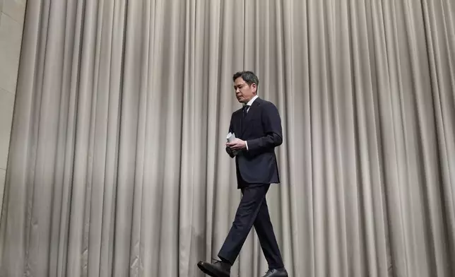 Chung Yong-jin, a chairman of Shinsegae Group, leaves after apologizing in Seoul, South Korea, Tuesday, May 26, 2026. (AP Photo/Lee Jin-man)