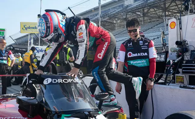 Takuma Sato, of Japan, climbs into his car during practice for the Indianapolis 500 auto race at the Indianapolis Motor Speedway in Indianapolis, Sunday, May 17, 2026. (AP Photo/Michael Conroy)