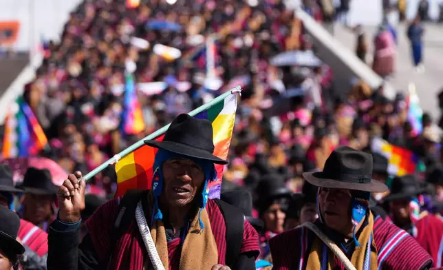 Aymara Indigenous people march during an anti-government protest in El Alto, Bolivia, Wednesday, May 13, 2026. (AP Photo/Juan Karita)