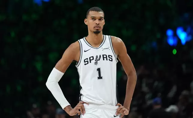 San Antonio Spurs forward Victor Wembanyama (1) waits for play to resume during the first half of Game 3 of a NBA basketball second-round playoff series against the Minnesota Timberwolves in Minneapolis, Friday, May 8, 2026. (AP Photo/Abbie Parr)