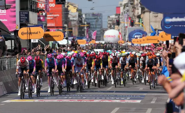 The pack of riders pedals during the 15th stage of the Giro d'Italia cycling race, from Voghera to Milan, Italy, Sunday, May 24, 2026. (Gian Mattia D'Alberto/LaPresse via AP)