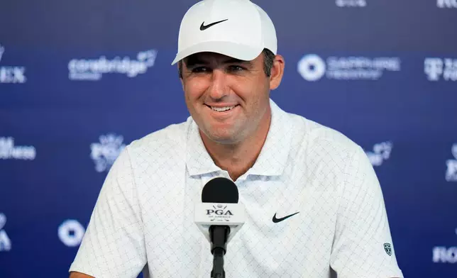 Scottie Scheffler speaks with the media after a PGA Championship golf tournament practice round at Aronimink Golf Club, Tuesday, May 12, 2026, in Newtown Square, PA. (AP Photo/Frank Franklin II)
