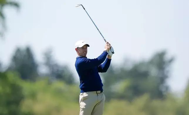 Rory McIlroy, of Northern Ireland, hits from the third fairway during a PGA Championship golf tournament practice round at Aronimink Golf Club, Tuesday, May 12, 2026, in Newtown Square, PA. (AP Photo/Matt Slocum)