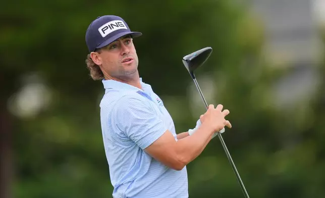 Taylor Moore watches his tee shot on the eighth hole during the first round of the Byron Nelson golf tournament in McKinney, Texas, Thursday, May 21, 2026. (AP Photo/LM Otero)