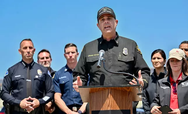 Orange County Fire Authority Division Chief Craig Covey speaks during a news conference at the Los Alamitos racetrack in Cypress, Calif., Friday, May 22, 2026, about hazmat situation in Garden Grove, Calif. (Jeff Gritchen/The Orange County Register via AP)