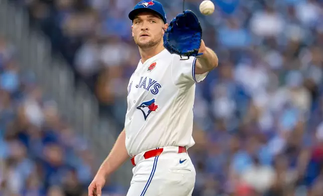 Toronto Blue Jays pitcher Trey Yesavage catches the ball during second-inning baseball game action against the Miami Marlins in Toronto, Monday May 25, 2026. (Frank Gunn/The Canadian Press via AP)