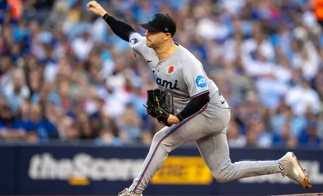 Miami Marlins starting pitcher Janson Junk throws to the Toronto Blue Jays during first-inning baseball game action in Toronto, Monday May 25, 2026. (Frank Gunn/The Canadian Press via AP)