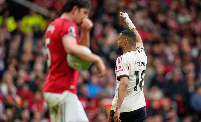 Liverpool's Cody Gakpo celebrates after scoring his side's second goal during the English Premier League soccer match between Manchester United and Liverpool in Manchester, England, Sunday, May 3, 2026. (AP Photo/Dave Thompson)