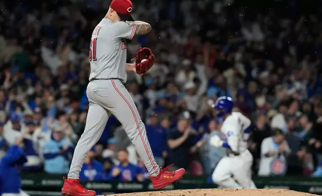 Cincinnati Reds starting pitcher C. Petty wipes his face after Chicago Cubs' Seiya Suzuki, of Japan, hit a three-run home run during the fourth inning of a baseball game in Chicago, Monday, May 4, 2026. (AP Photo/Nam Y. Huh)