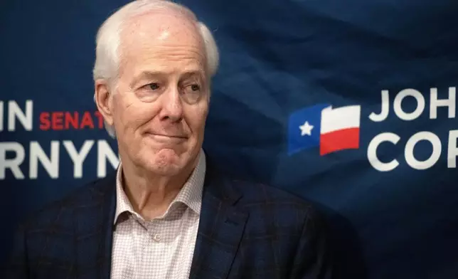 Sen. John Cornyn, R-Texas, listens to State Sen. Charles Perry, R-Lubbock, during a campaign event in Lubbock, Texas, Tuesday, May 19, 2026. (AP Photo/Annie Rice)