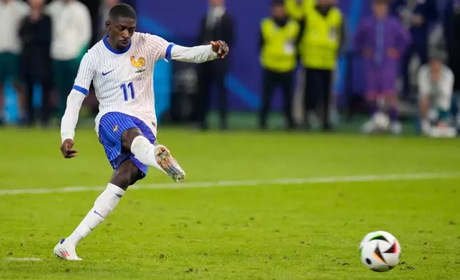 FILE - Ousmane Dembele of France scores during a penalty shootout against Portugal during a quarter final match at the Euro 2024 soccer tournament in Hamburg, Germany, Friday, July 5, 2024. (AP Photo/Hassan Ammar, File)