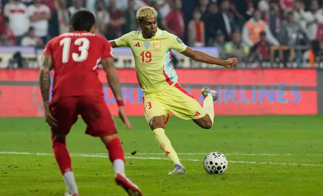 FILE - Spain's Lamine Yamal attempts a shot on goal during a World Cup qualifying round Group E soccer match between Turkey and Spain at Konya Buyuksehir stadium, in Konya, Turkey, Sunday, Sept. 7, 2025. (AP Photo/Khalil Hamra, File)